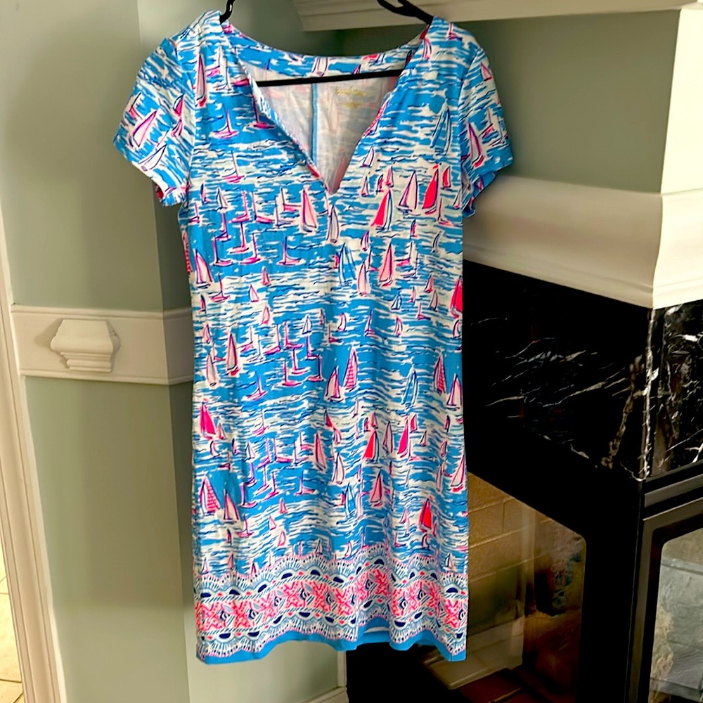 Lilly size small dress. It does stretch. Very cute and vivid colors